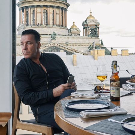 Nele Lindemann's father, Till Lindemann enjoying a glass of wine.